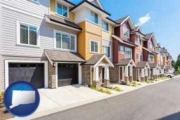 a row of townhouses with Connecticut map icon