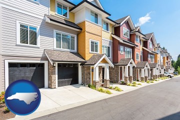a row of townhouses with North Carolina map icon