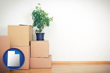 an unfurnished apartment with moving boxes with Utah map icon